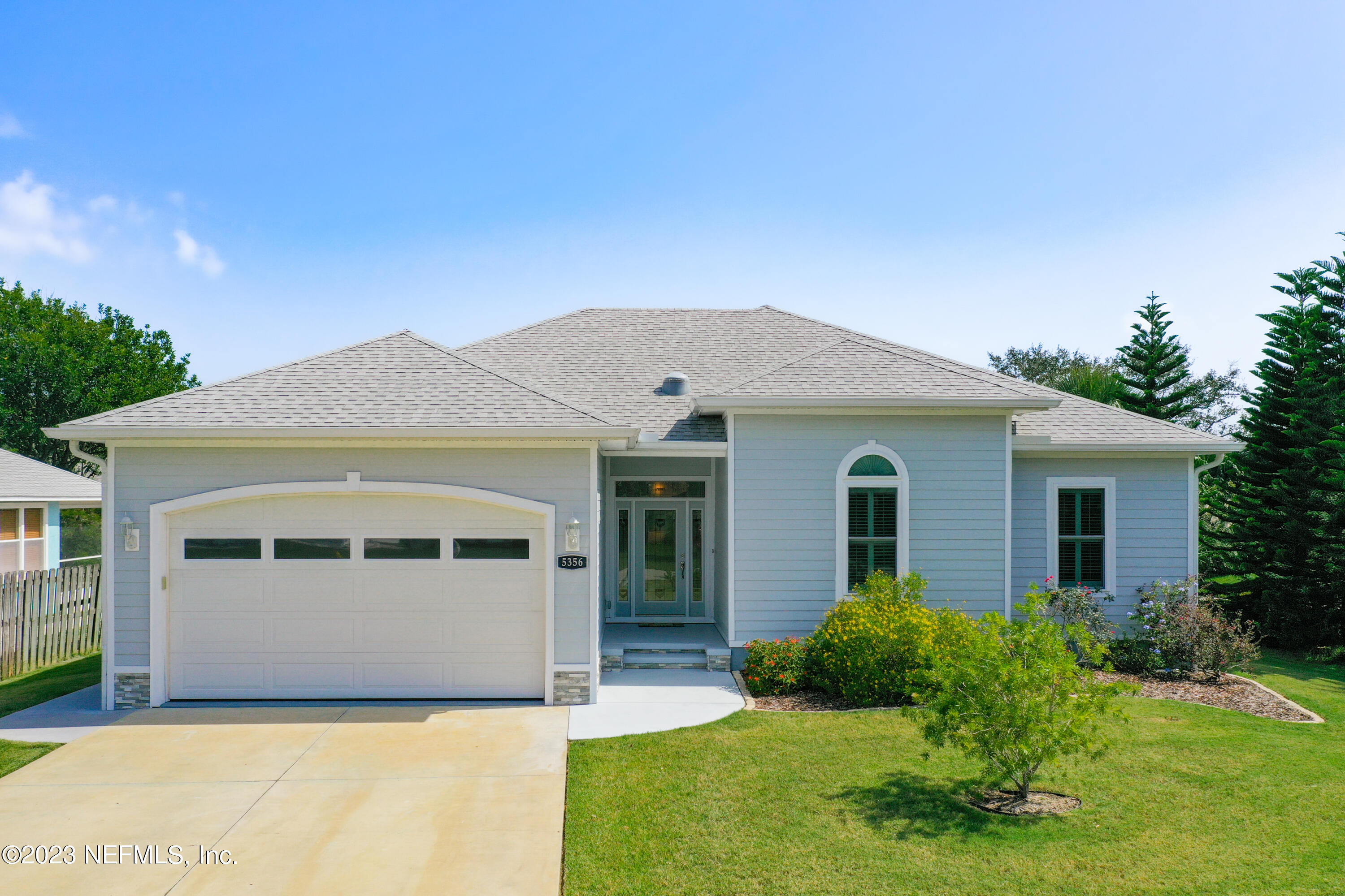 5356 2nd Street St. Augustine, FL 32080 - Photo 5 of 60 a front view of a house with garden