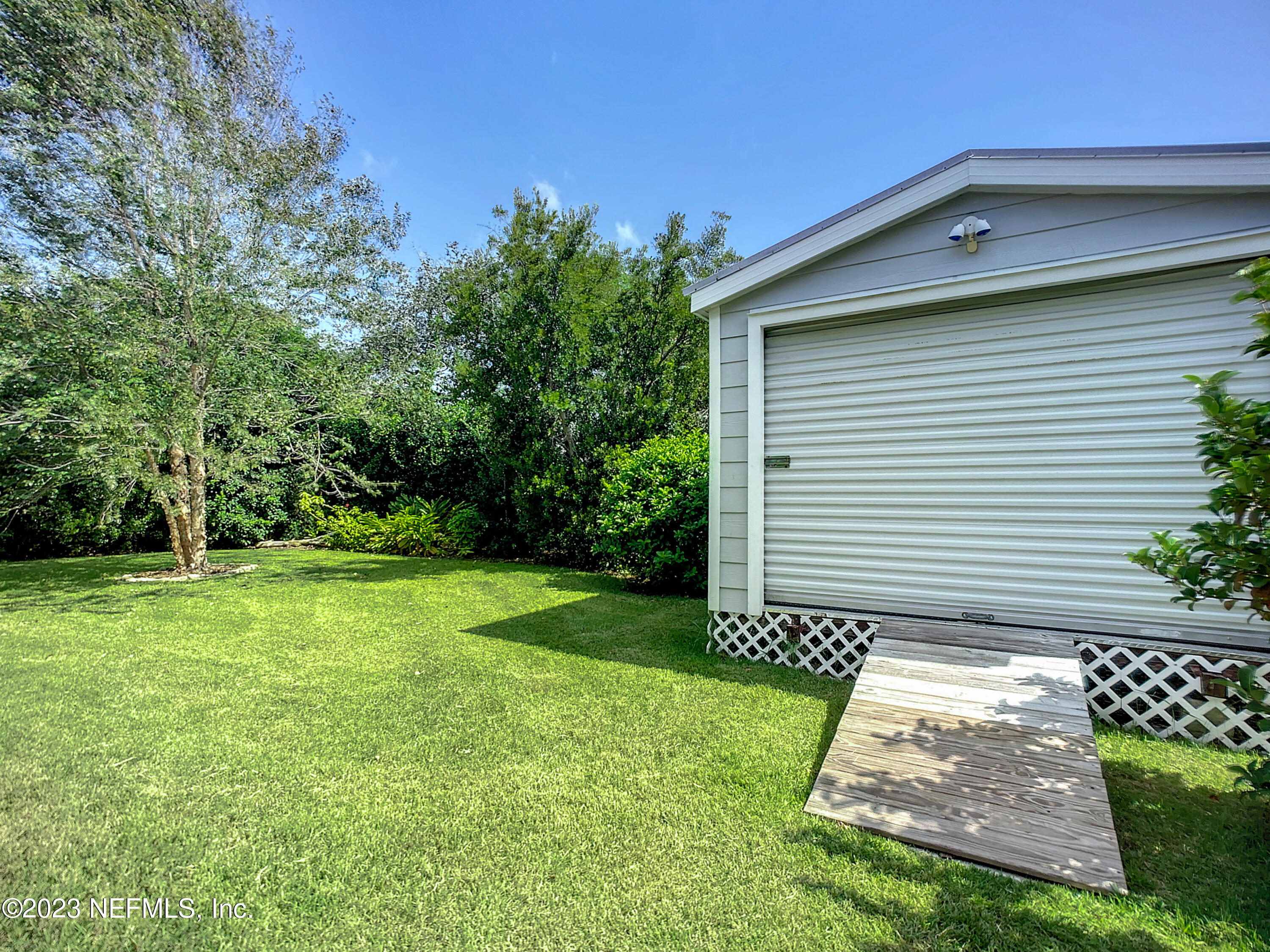 5356 2nd Street St. Augustine, FL 32080 - Photo 54 of 60 a front view of a house with garden