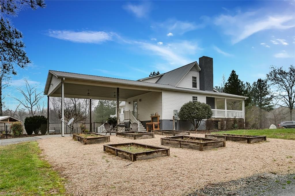 306 Charlie S Road Robbins, NC 27325 - Photo 25 of 30 Exterior Back with raised garden beds