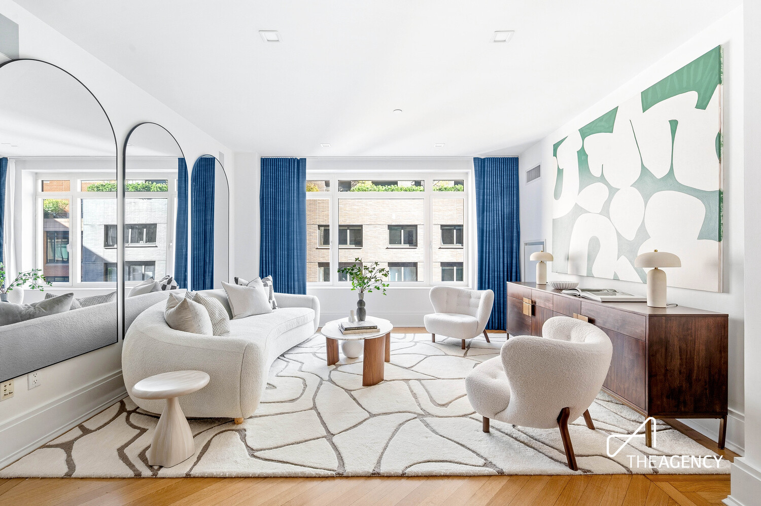 205 West 76th Street, Unit 1202 Manhattan, NY 10023 - Photo 1 of 11 a living room with furniture a table and chair with wooden floor