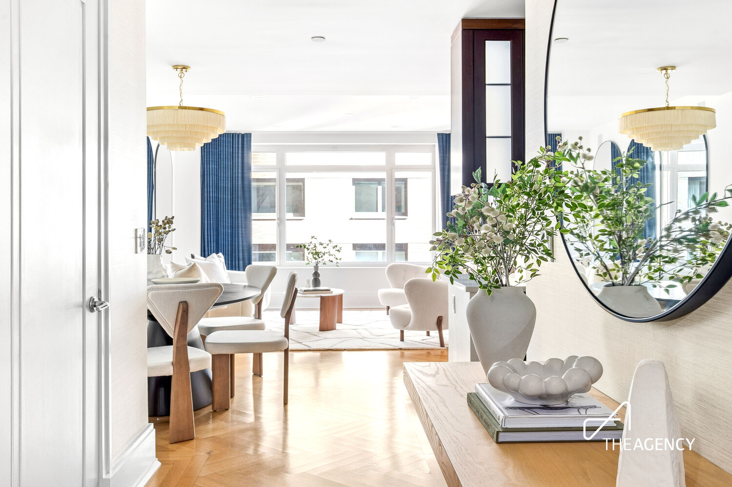 205 West 76th Street, Unit 1202 Manhattan, NY 10023 - Photo 10 of 11 a living room with furniture and a chandelier