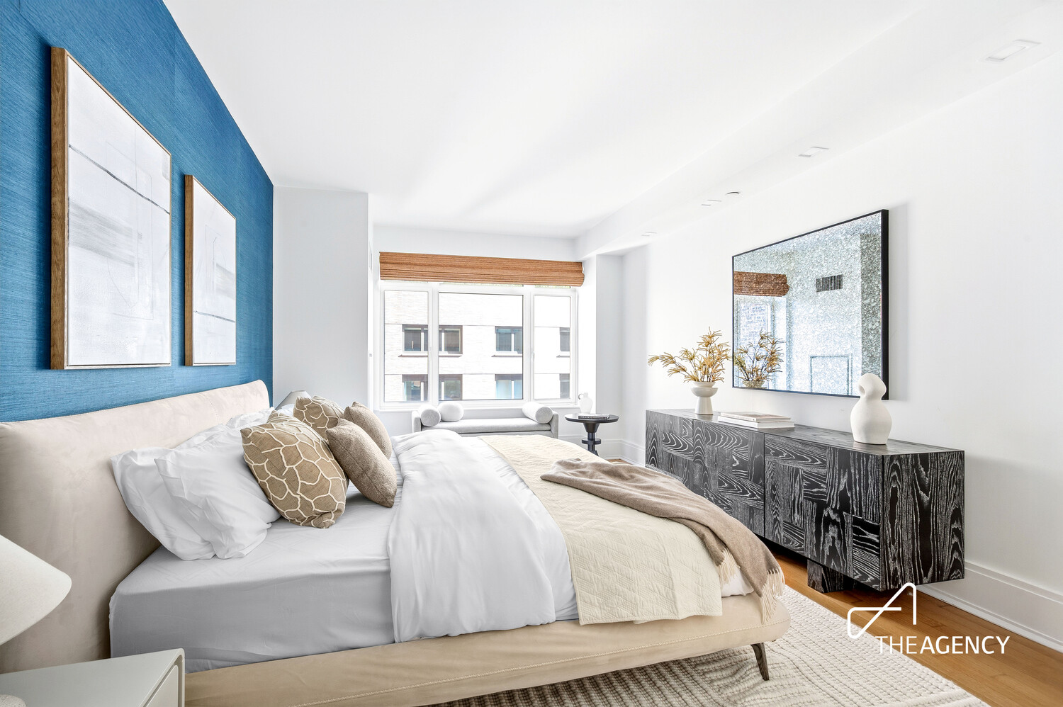 205 West 76th Street, Unit 1202 Manhattan, NY 10023 - Photo 6 of 11 a bedroom with a bed and glass windows