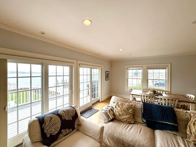 a spacious bedroom with a bed and a flat screen tv