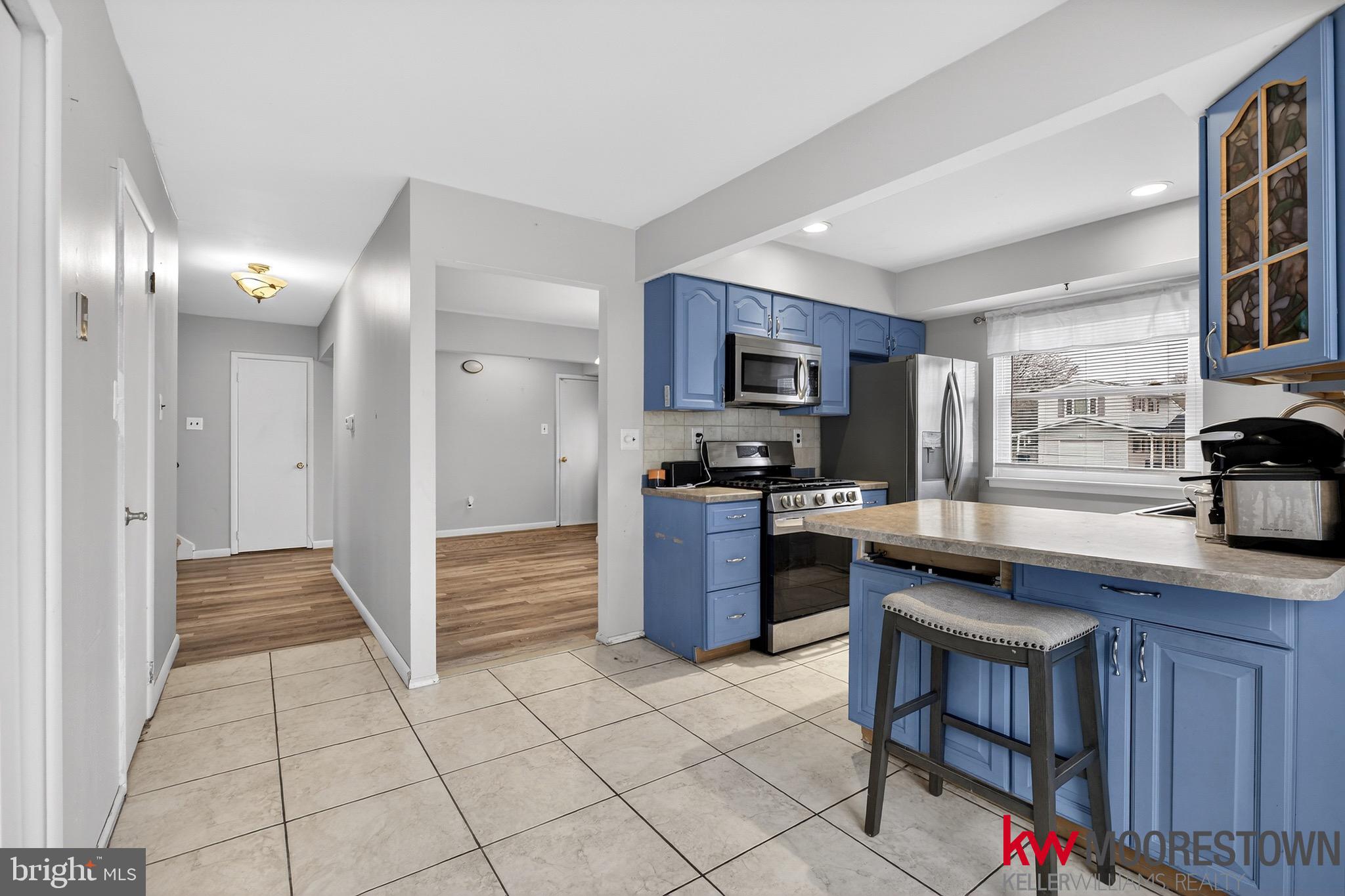 19 Nottingham Way Eastampton, NJ 08060 - Photo 13 of 44 a kitchen with stainless steel appliances granite countertop a stove top oven a sink dishwasher and a refrigerator