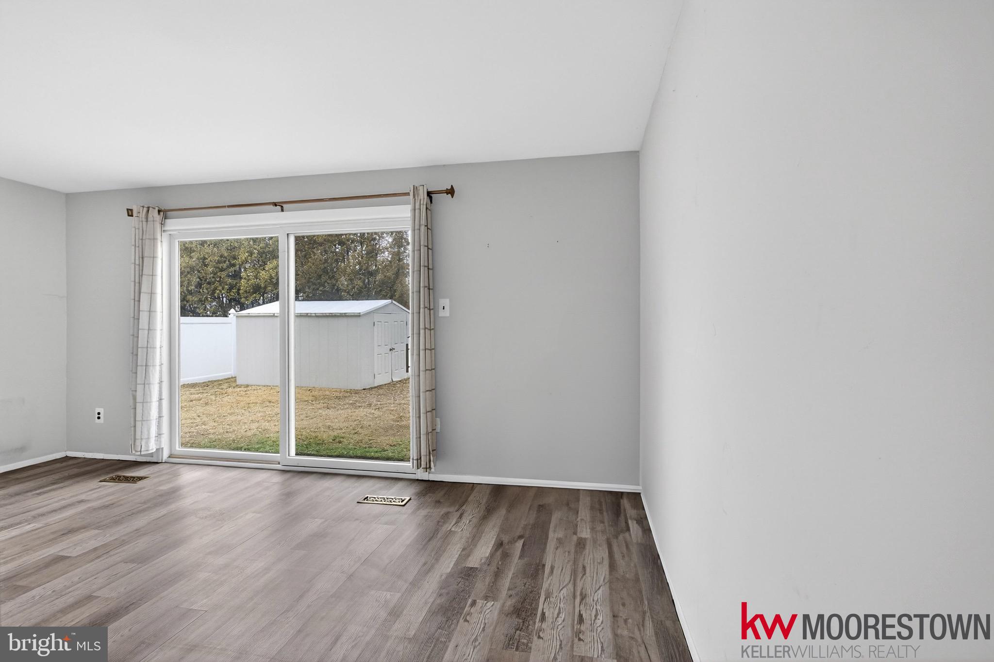 19 Nottingham Way Eastampton, NJ 08060 - Photo 15 of 44 an empty room with wooden floor and windows