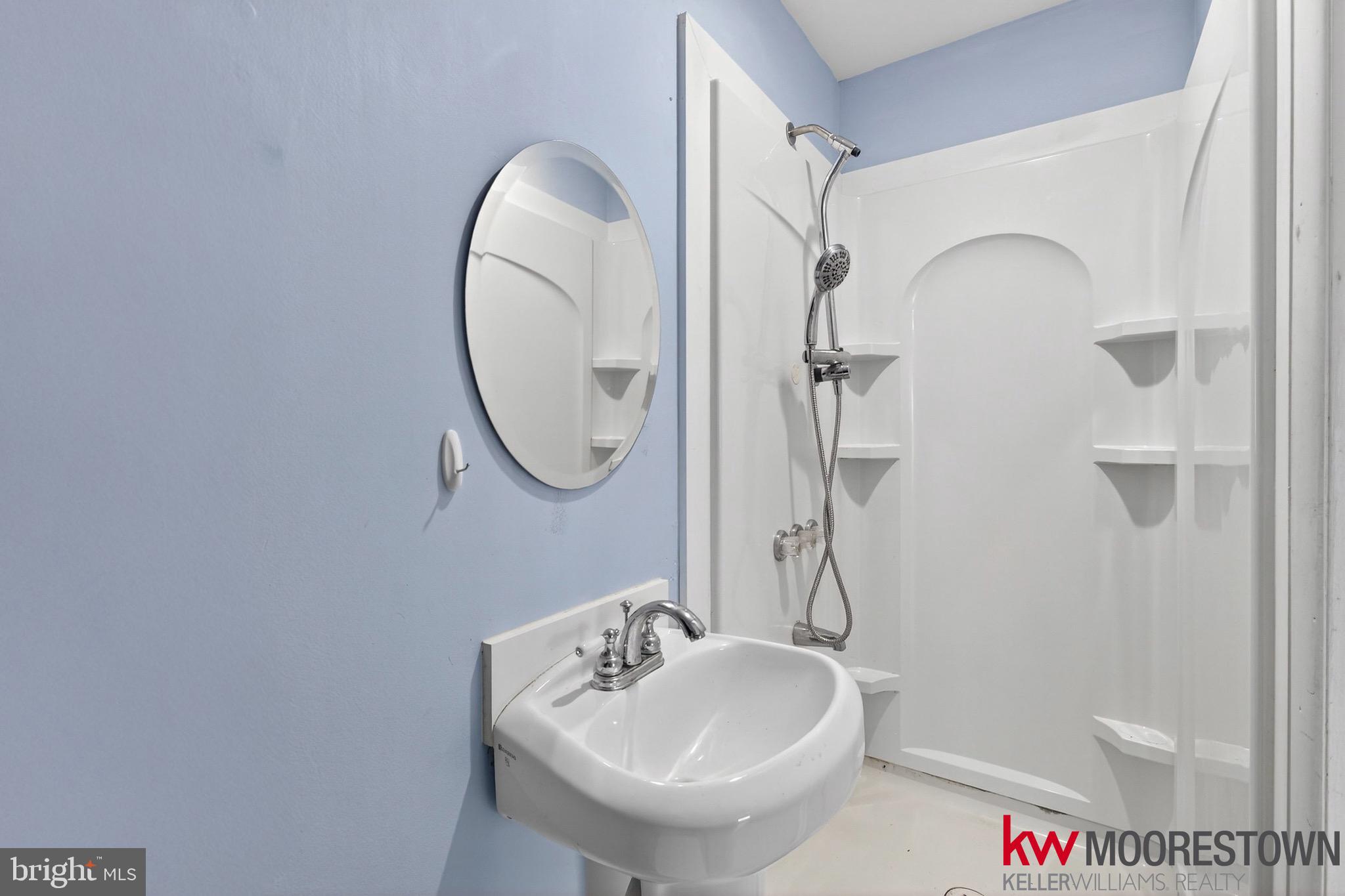 19 Nottingham Way Eastampton, NJ 08060 - Photo 16 of 44 a bathroom with a sink and a mirror