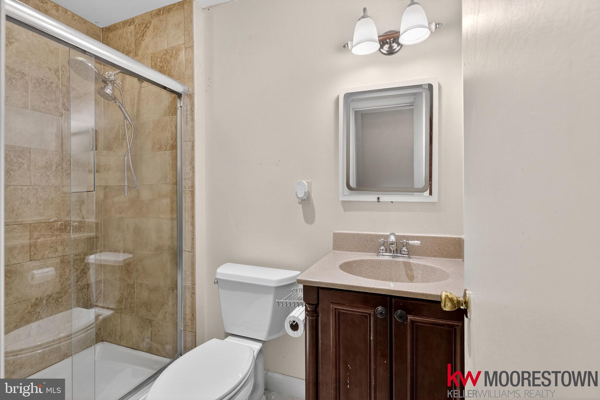 19 Nottingham Way Eastampton, NJ 08060 - Photo 32 of 44 a bathroom with a sink a toilet and shower