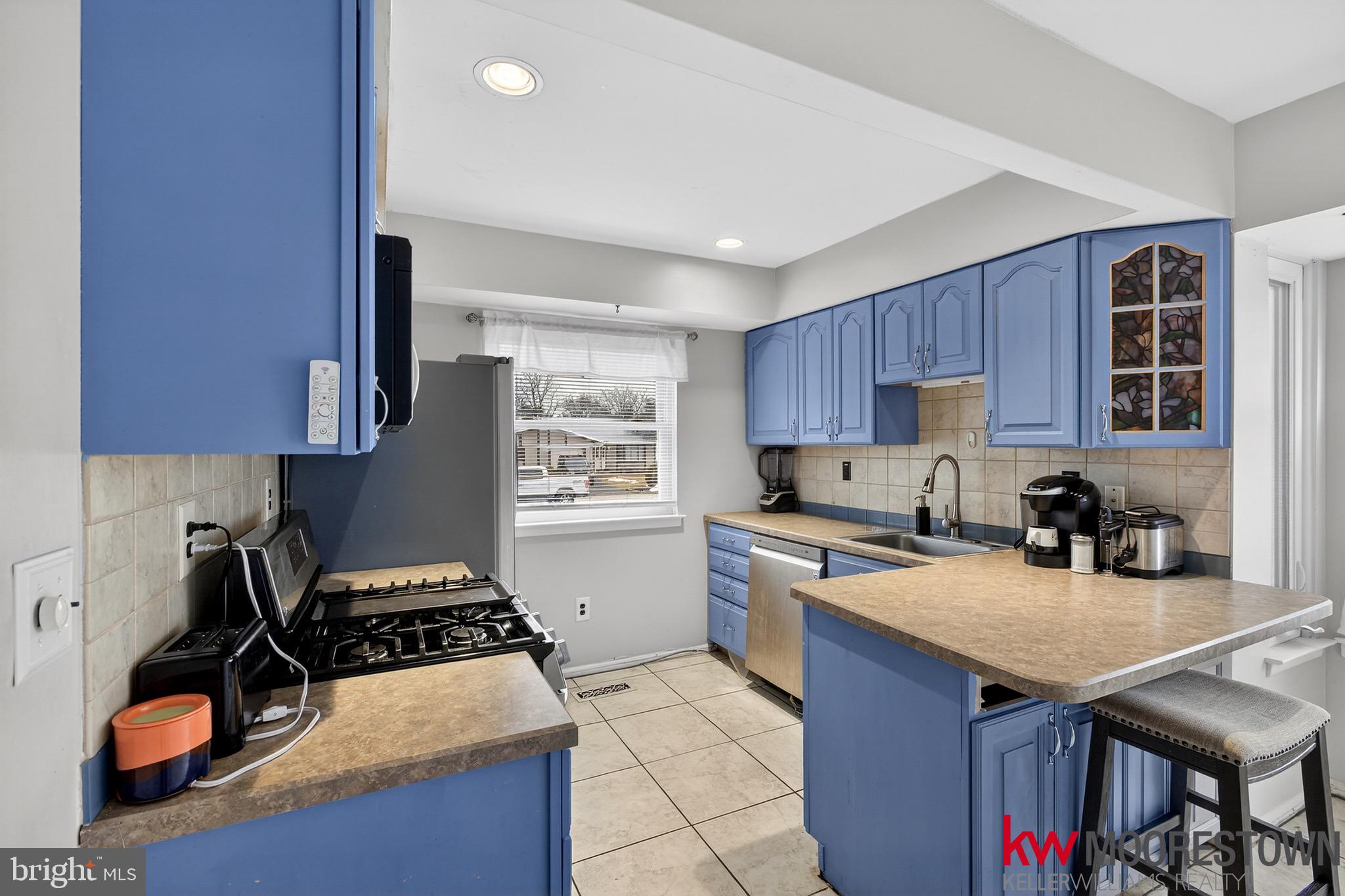 19 Nottingham Way Eastampton, NJ 08060 - Photo 8 of 44 a kitchen with a stove a sink and a refrigerator