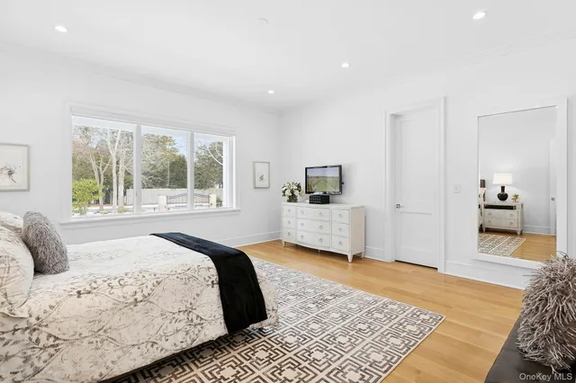 a bedroom with a large bed and a couch