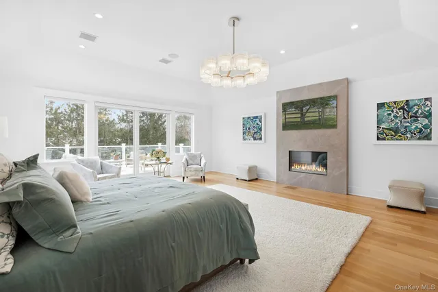 a spacious bedroom with a bed and a fireplace