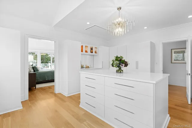 a spacious bathroom with a sink double vanity granite and a mirror