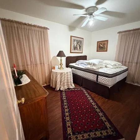 a living room with furniture rug and a window