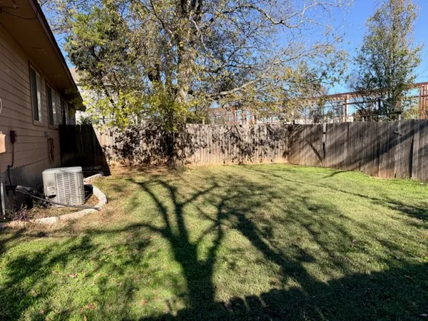 a view of a house with a backyard and garden