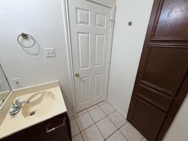 a bathroom with a sink and mirror