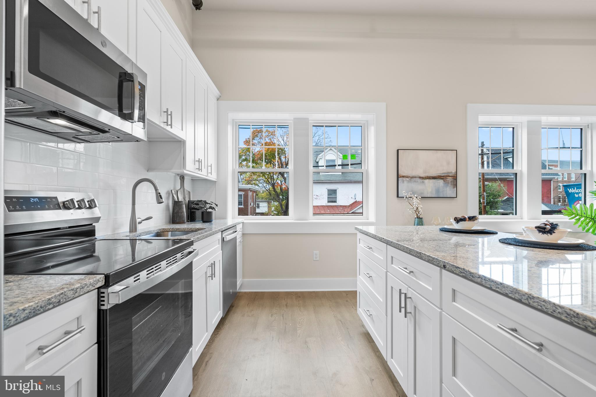 30 West Broad Street Souderton, PA 18964 - Photo 16 of 32 a kitchen with a sink stove and cabinets