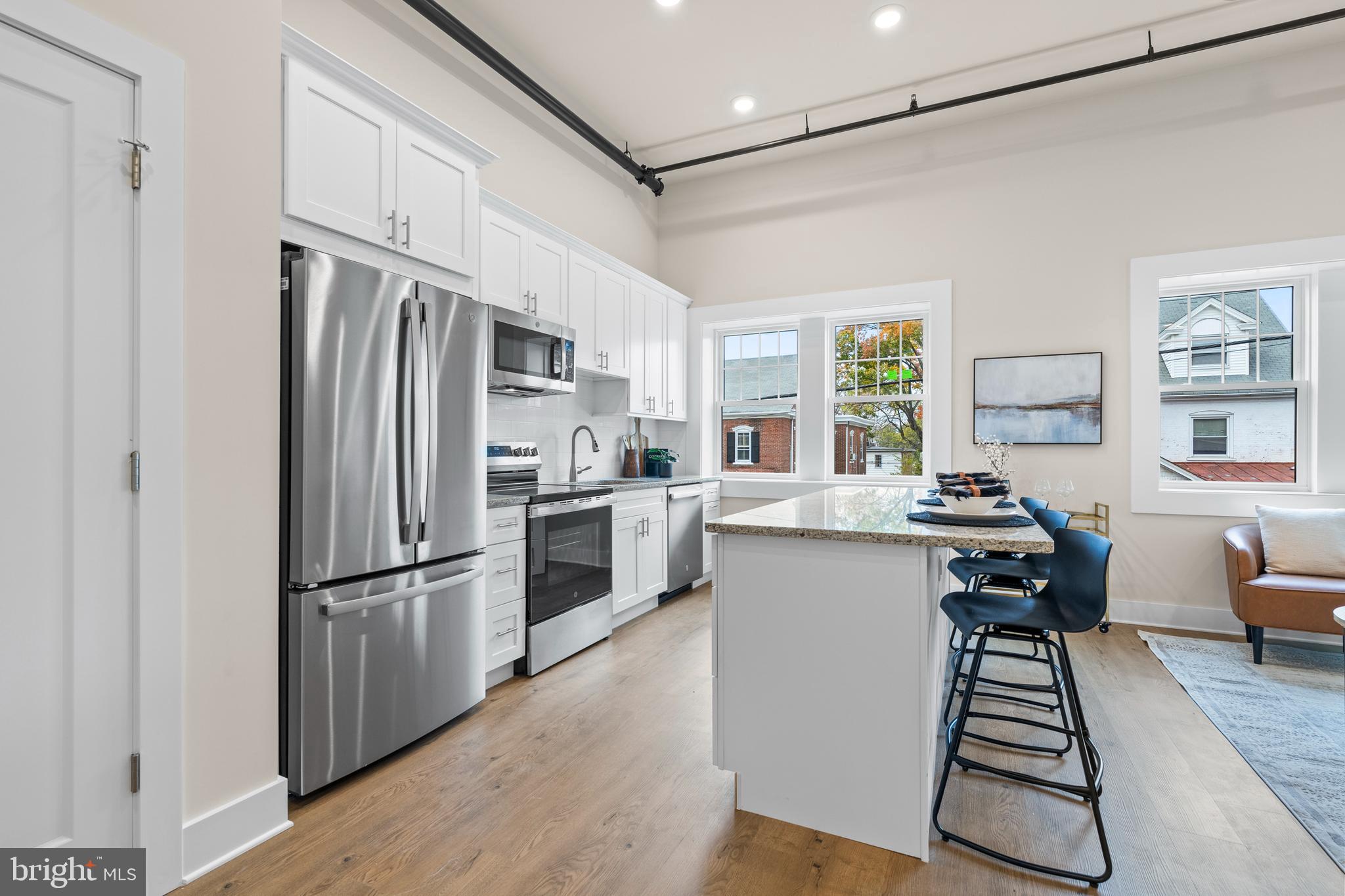 30 West Broad Street Souderton, PA 18964 - Photo 17 of 32 a kitchen with stainless steel appliances a refrigerator and a stove top oven