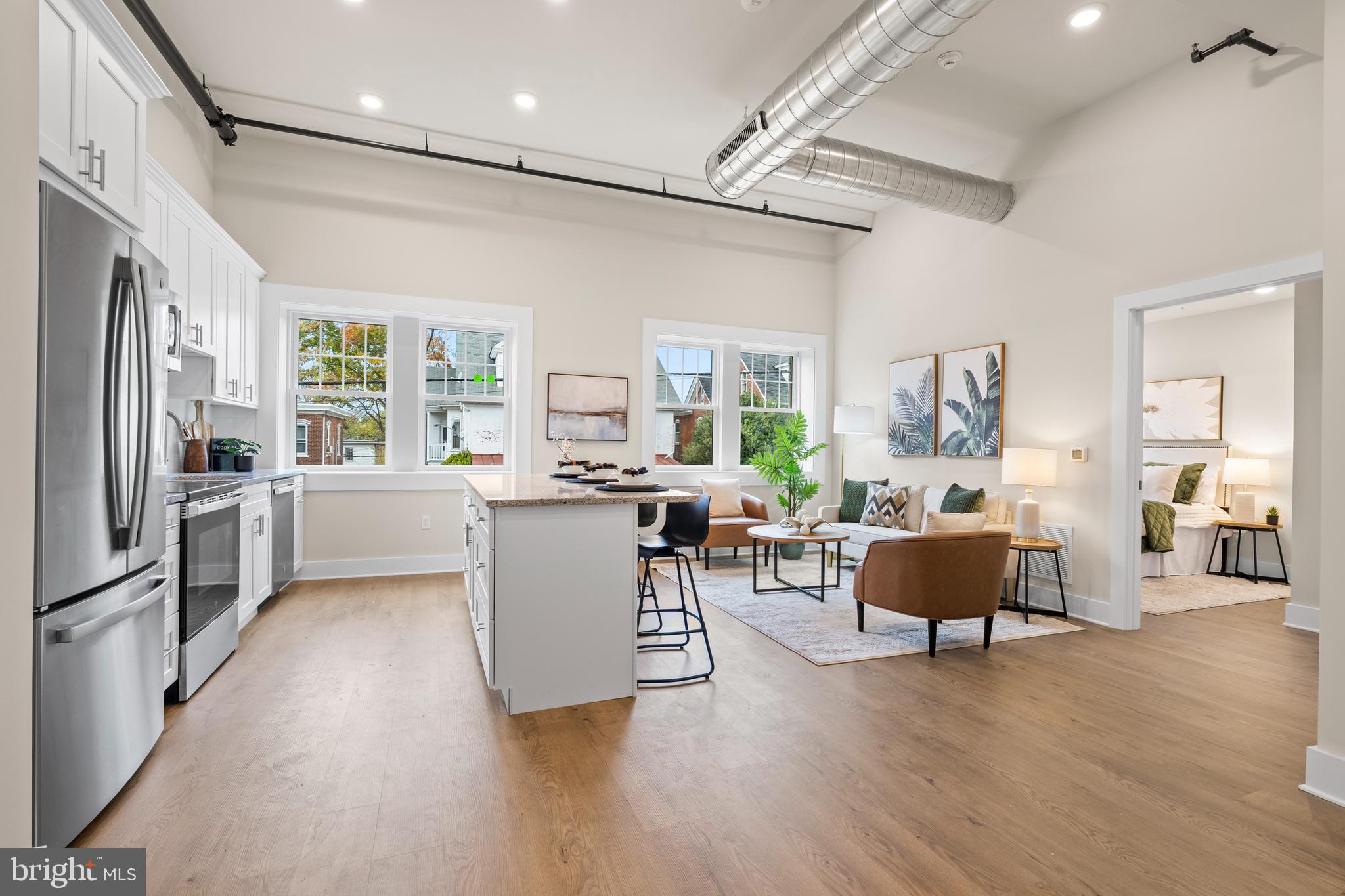 30 West Broad Street Souderton, PA 18964 - Photo 2 of 32 a kitchen with a refrigerator and wooden floor