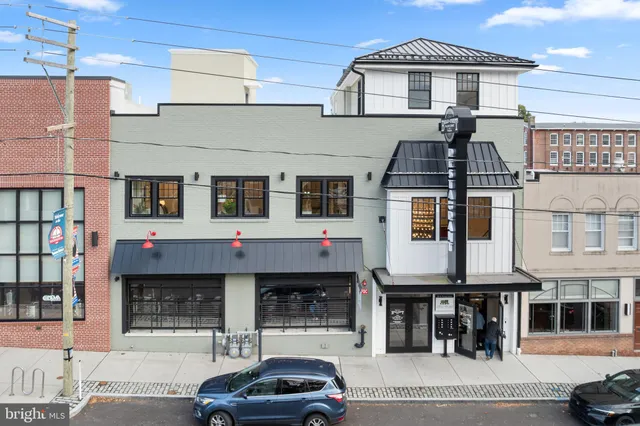 a black and white building with a outdoor space