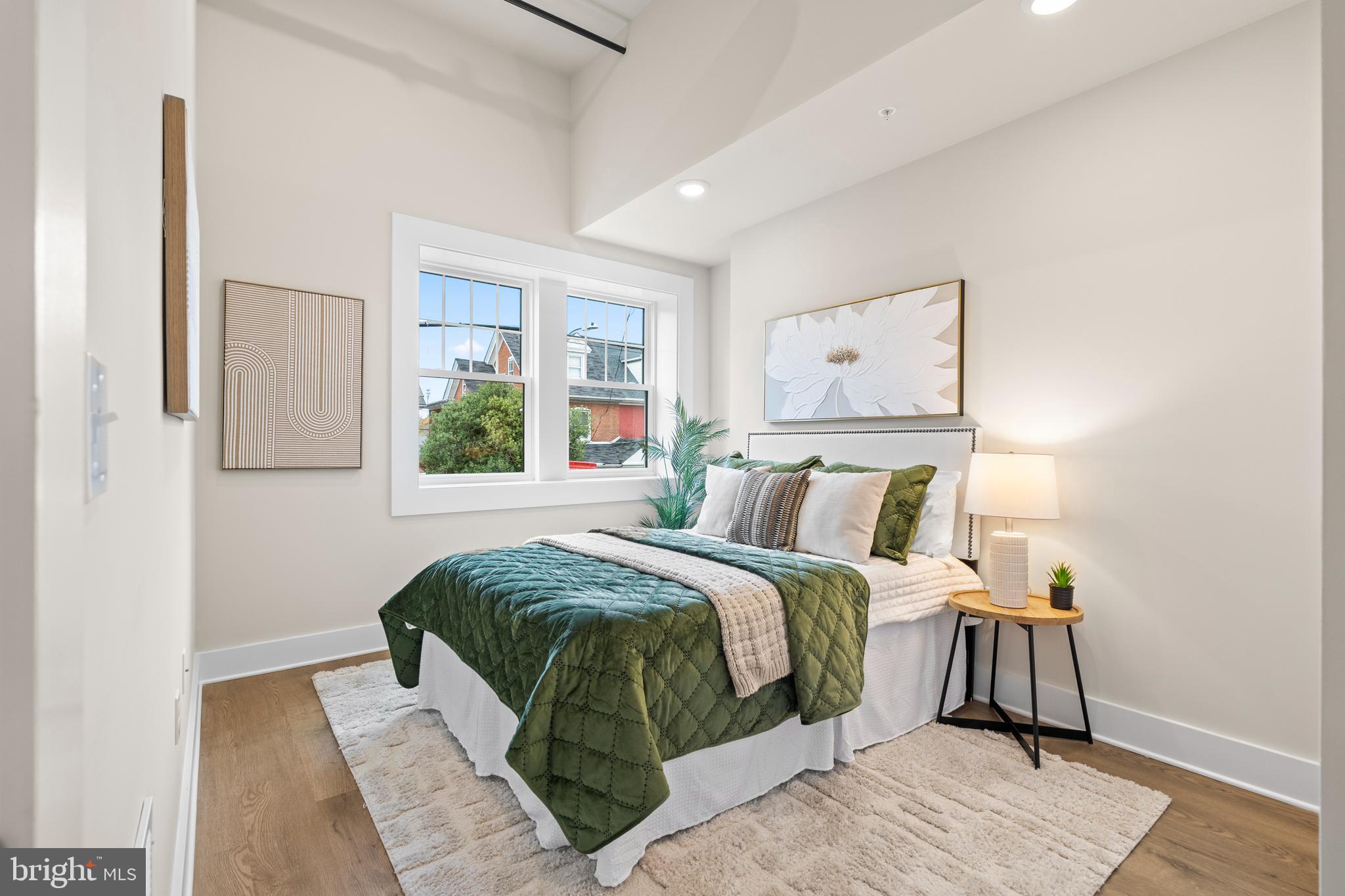 30 West Broad Street Souderton, PA 18964 - Photo 10 of 32 a bed sitting in a bedroom next to a window