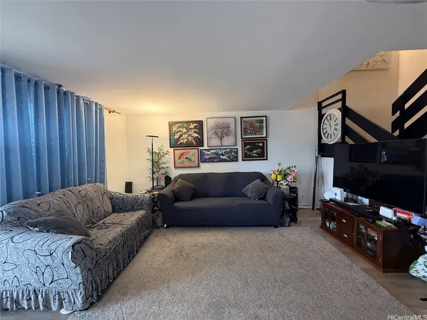 a living room with furniture and a couch