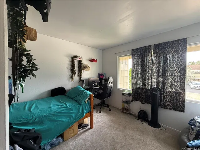 a bedroom with furniture and a couch