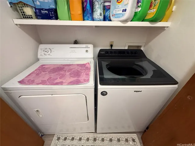 a bedroom with two beds and a window