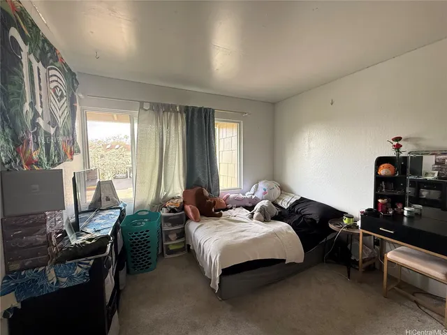 a bathroom with a toilet sink vanity and mirror
