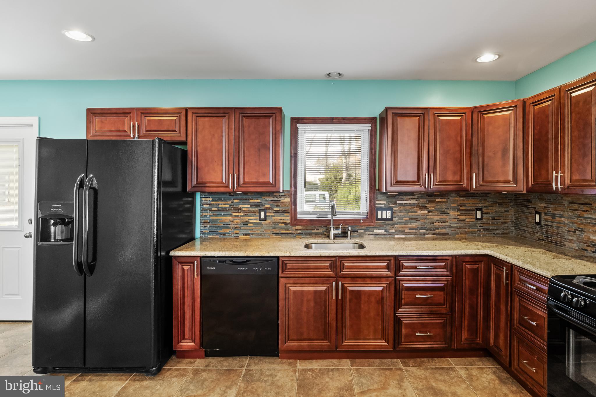 501 West Evesham Road Runnemede, NJ 08078 - Photo 11 of 35 a kitchen with stainless steel appliances granite countertop a refrigerator and a sink