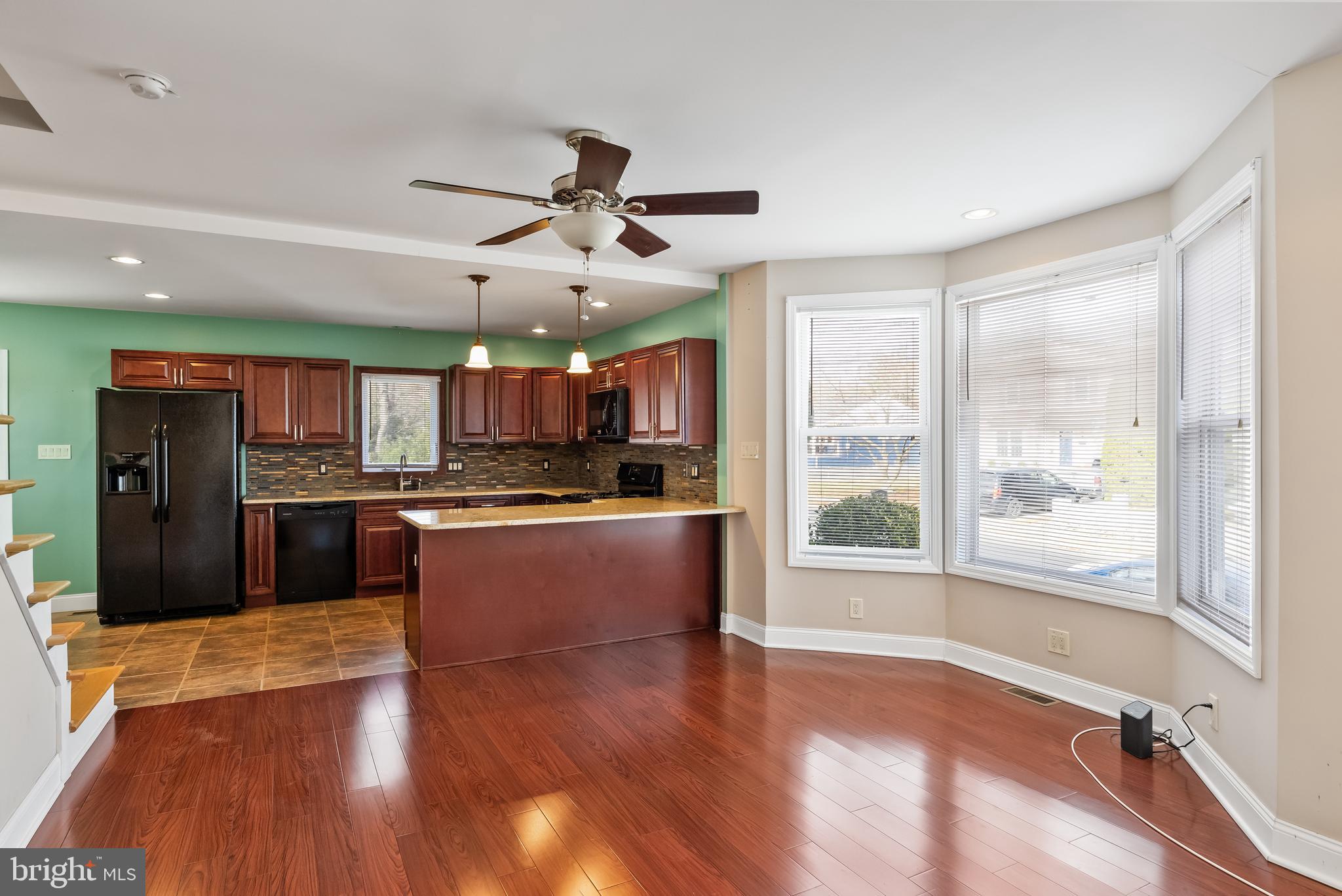 501 West Evesham Road Runnemede, NJ 08078 - Photo 15 of 35 a large kitchen with stainless steel appliances wooden floor and a large window