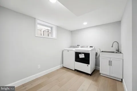 a utility room with washer and dryer