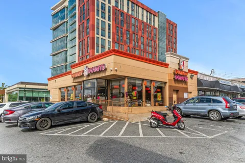 a view of cars parked in front of a building