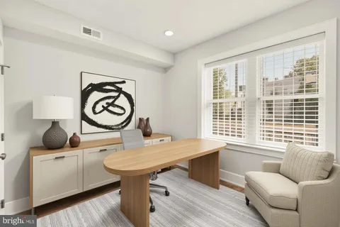 a reading room with furniture and windows