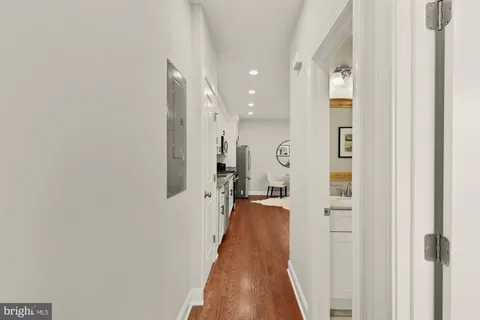 a view of a hallway with a white walls
