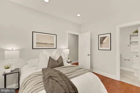 a bed room with a bed and a painting