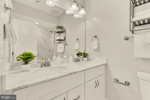 a bathroom with a sink a faucet and a mirror