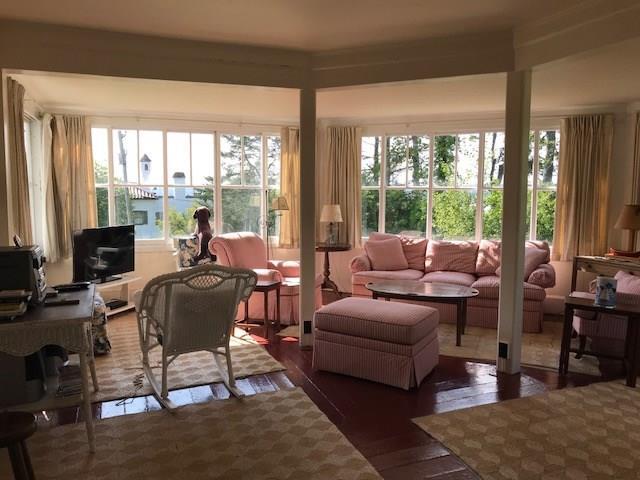 68 Battle Avenue Castine, ME 04421 - Photo 6 of 26 Living room and enclosed porch great...