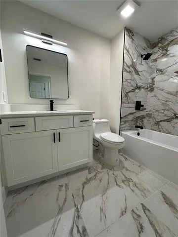 a kitchen with a cabinets and white appliances