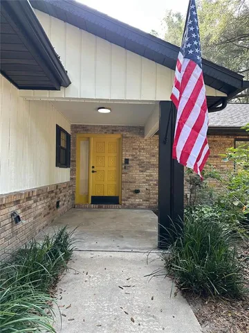 a view of a wooden door and a space
