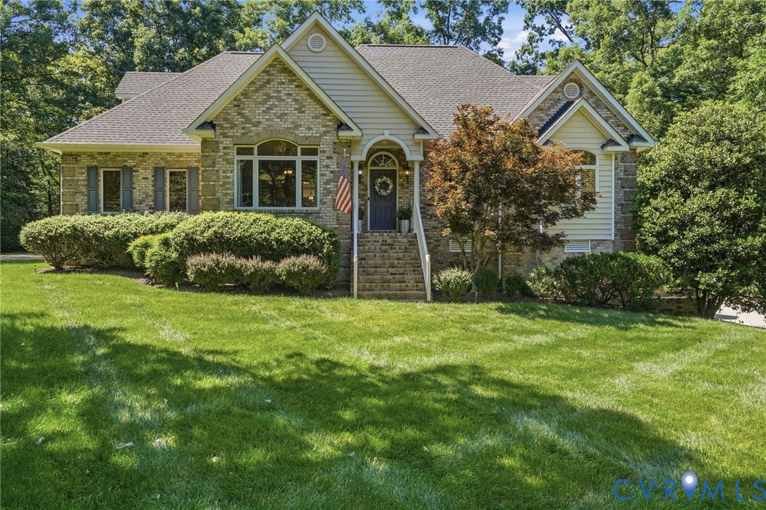 12123 Deer Ridge Court Ashland, VA 23005 - Photo 1 of 63 a front view of a house with a garden