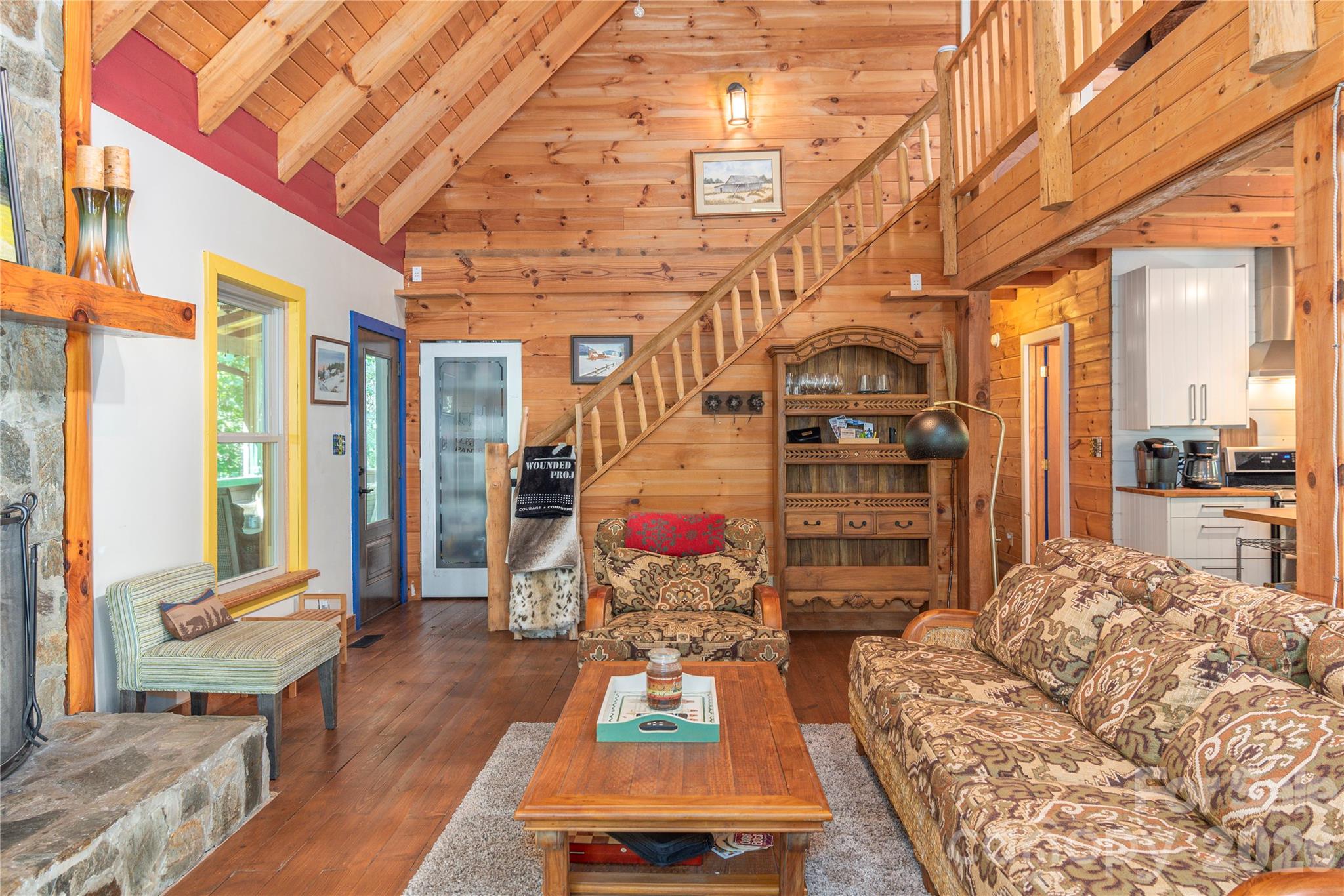 40 Shook Cove Road Leicester, NC 28748 - Photo 11 of 48 a living room with furniture and a flat screen tv