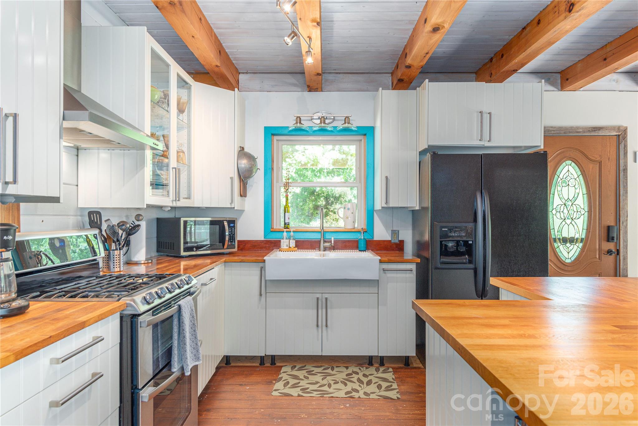 40 Shook Cove Road Leicester, NC 28748 - Photo 17 of 48 a kitchen with stainless steel appliances granite countertop a sink stove and refrigerator