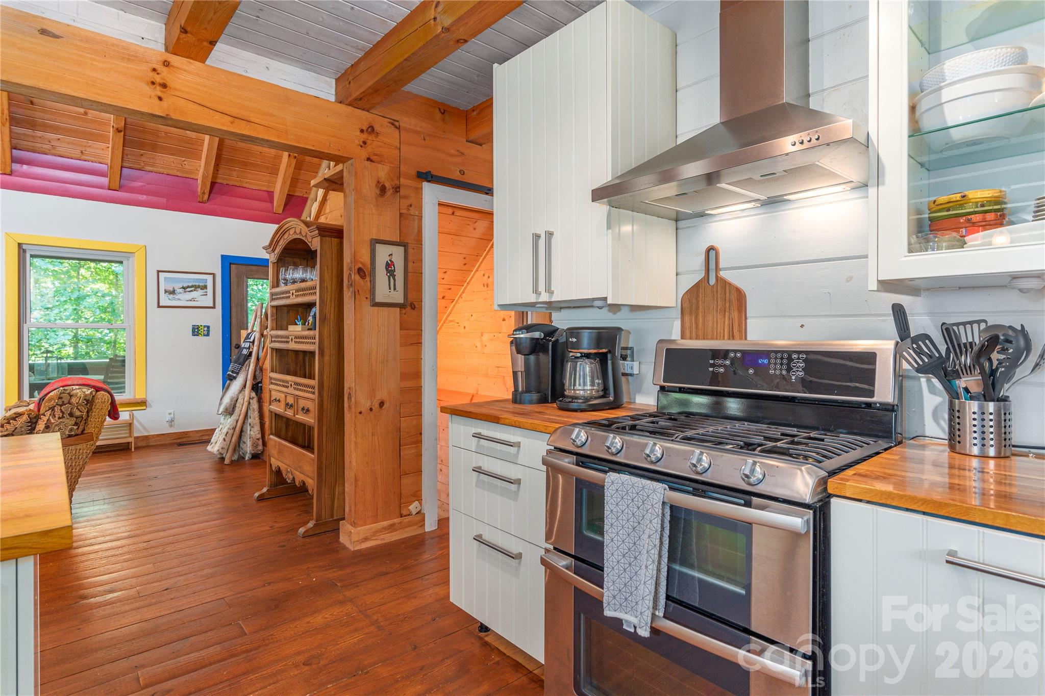 40 Shook Cove Road Leicester, NC 28748 - Photo 19 of 48 a kitchen with stainless steel appliances granite countertop a stove and a refrigerator