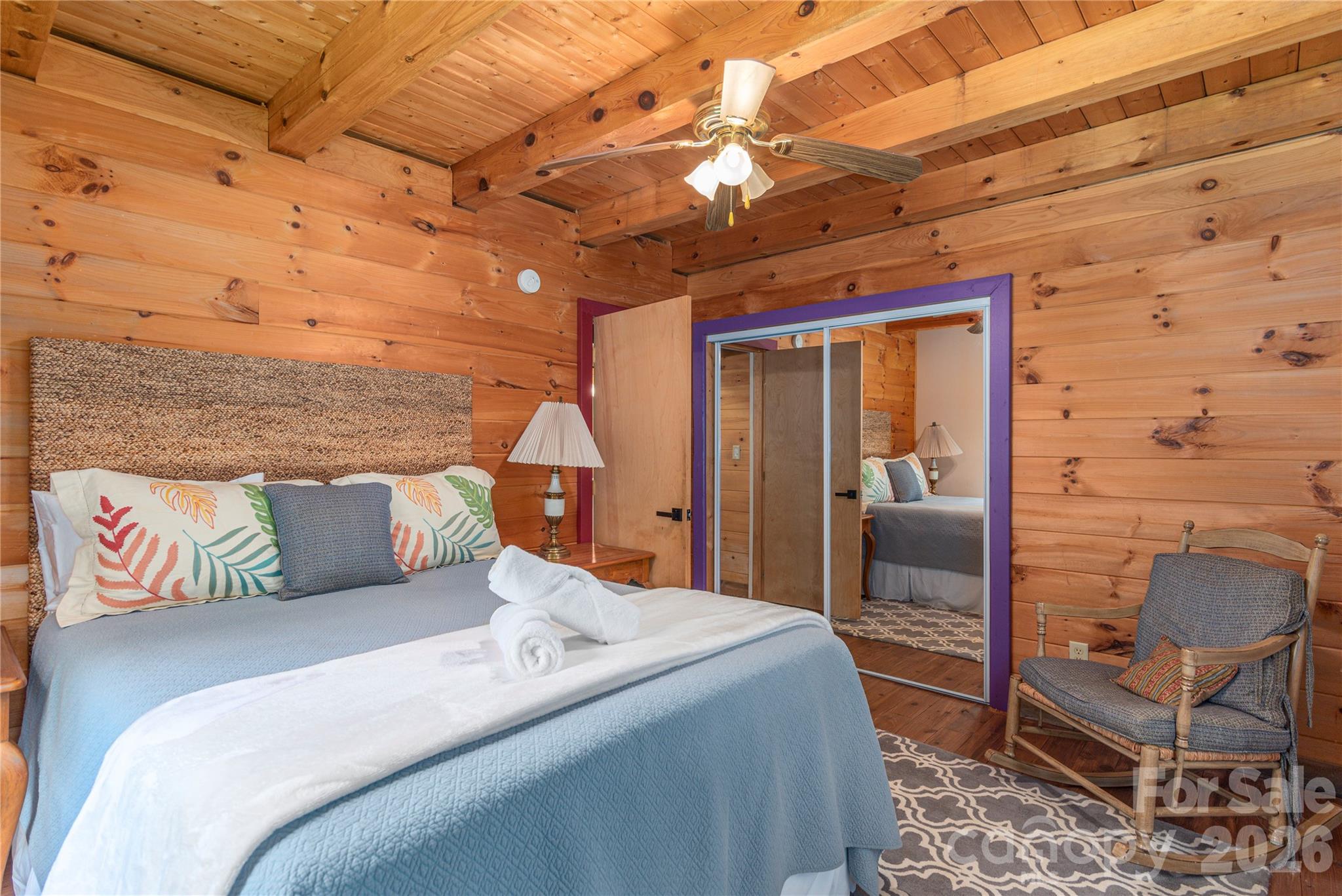 40 Shook Cove Road Leicester, NC 28748 - Photo 25 of 48 a bedroom with a bed and wooden floor