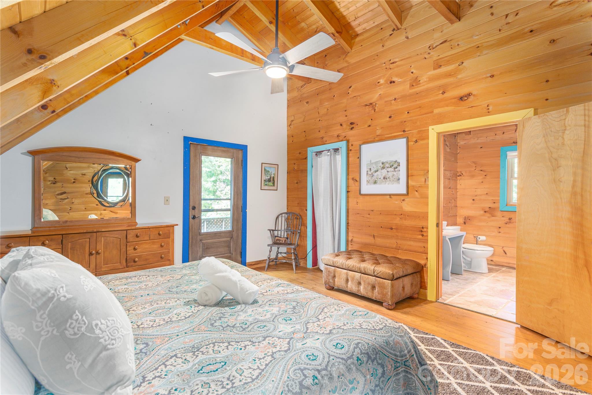 40 Shook Cove Road Leicester, NC 28748 - Photo 33 of 48 a bedroom with a bed and wooden floor