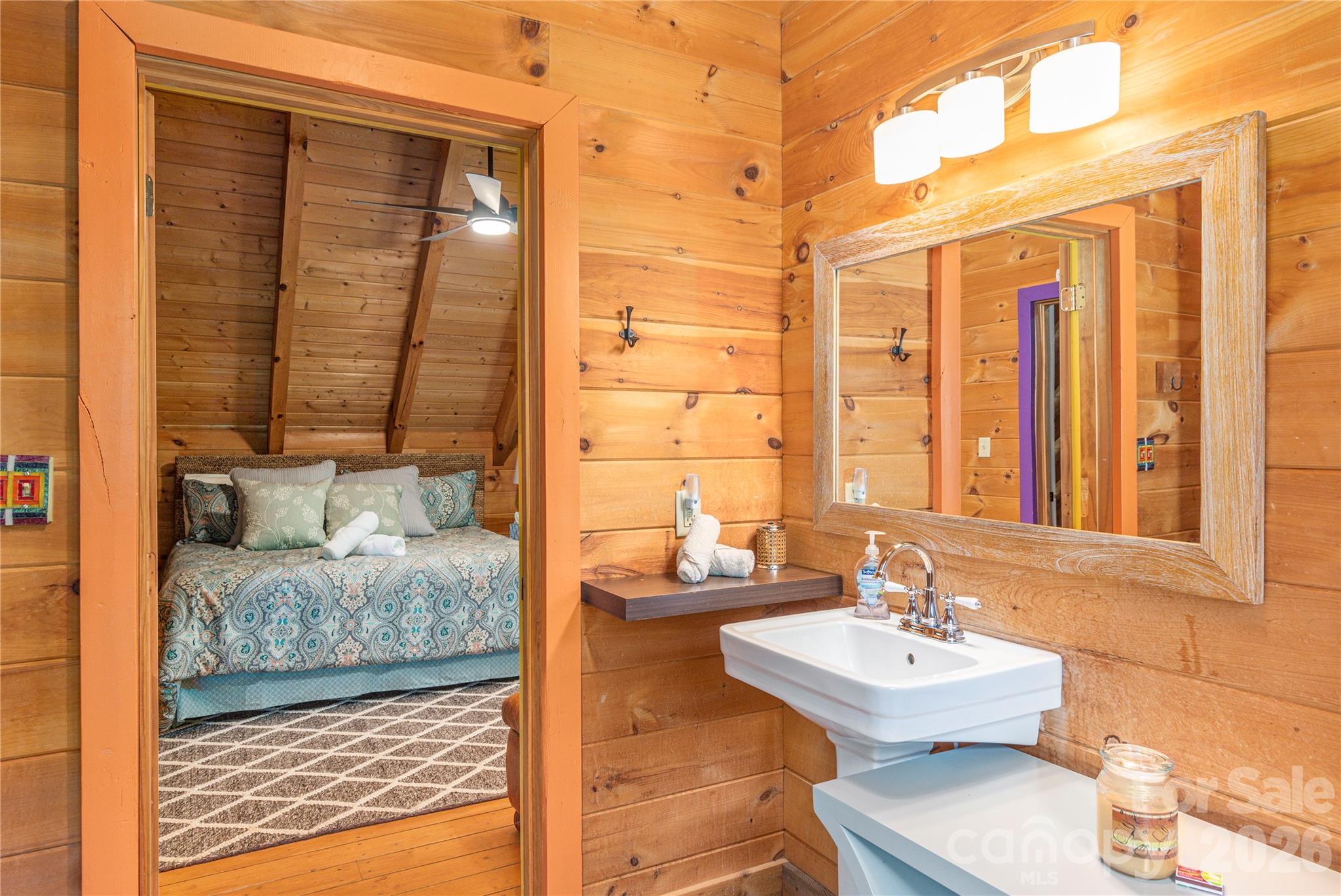 40 Shook Cove Road Leicester, NC 28748 - Photo 36 of 48 a bathroom with a sink and a mirror