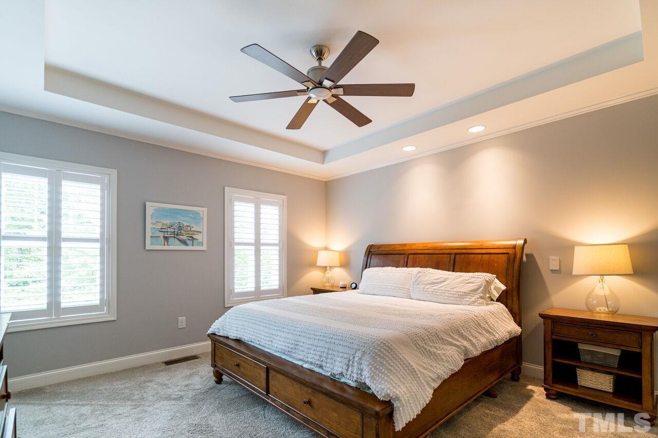 1517 Fullerton Place Raleigh, NC 27607 - Photo 18 of 30 Owner's suite w/ tray ceiling, recessed lighting, fan, shutters, WIC w/ stunning California Closets built in & en suite bath.