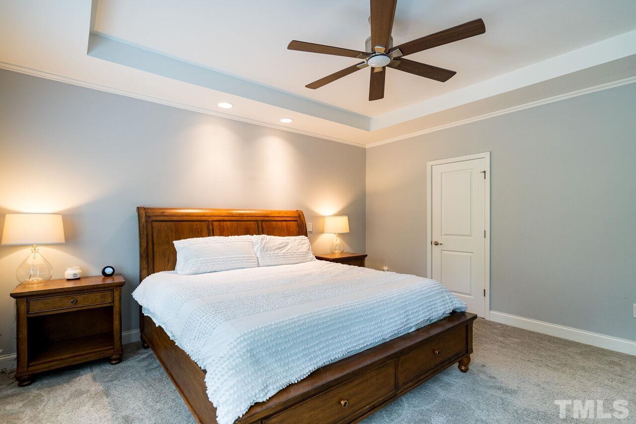 1517 Fullerton Place Raleigh, NC 27607 - Photo 19 of 30 Owner's suite w/ tray ceiling, recessed lighting, fan, shutters, WIC w/ stunning California Closets built in & en suite bath.