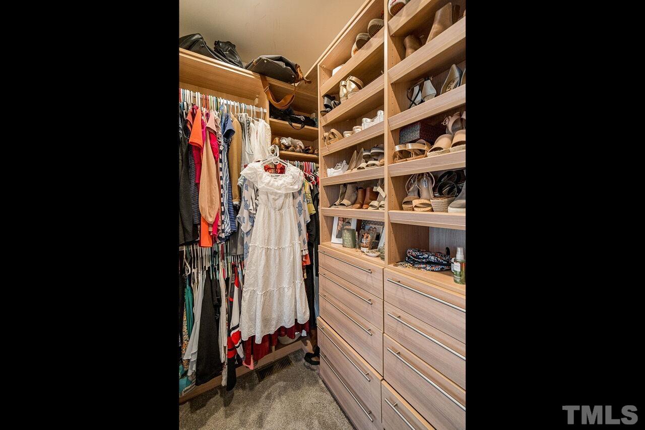 1517 Fullerton Place Raleigh, NC 27607 - Photo 23 of 30 Custom California Closets design for this walk in closet you won't forget or want to leave!
