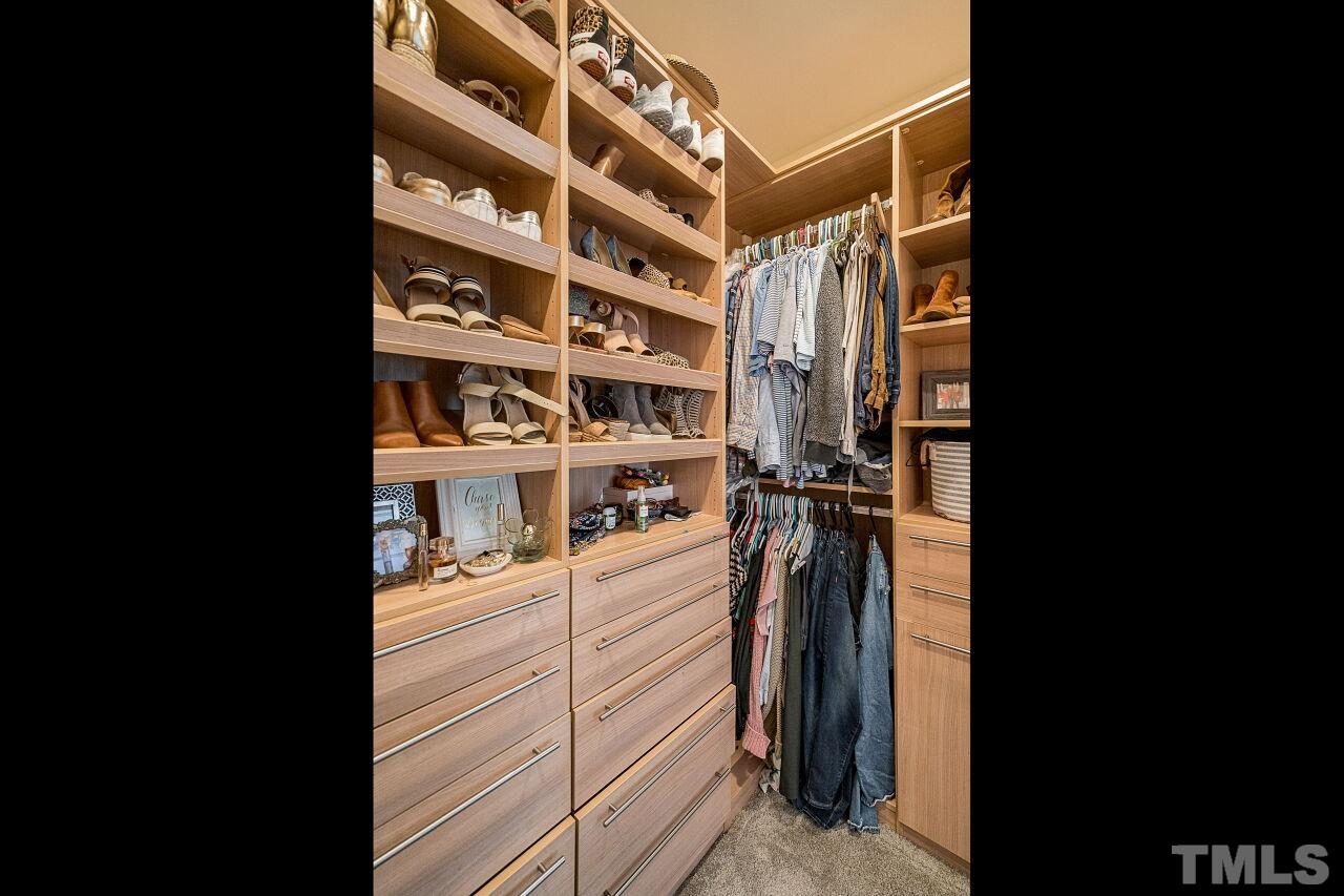 1517 Fullerton Place Raleigh, NC 27607 - Photo 24 of 30 Custom California Closets design for this walk in closet you won't forget or want to leave!