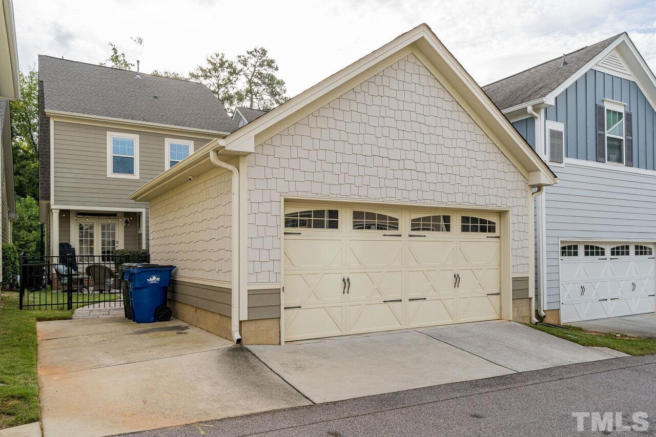 1517 Fullerton Place Raleigh, NC 27607 - Photo 29 of 30 Two car garage plus parking pad w/ rear access. Additional parking on the street out front.